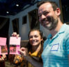 Educators hold workshop materials while participating in a Roundabout Theatre Company professional development session.